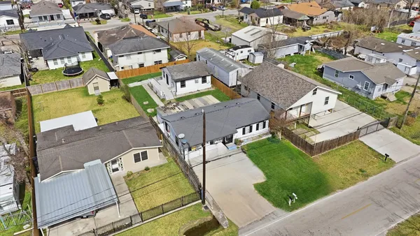 an aerial view of a house with a garden