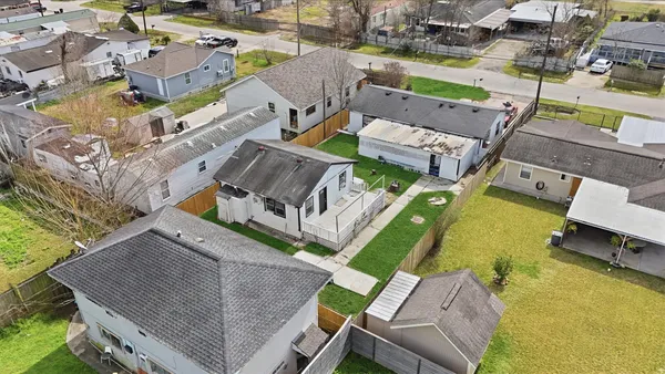 an aerial view of a house with a swimming pool