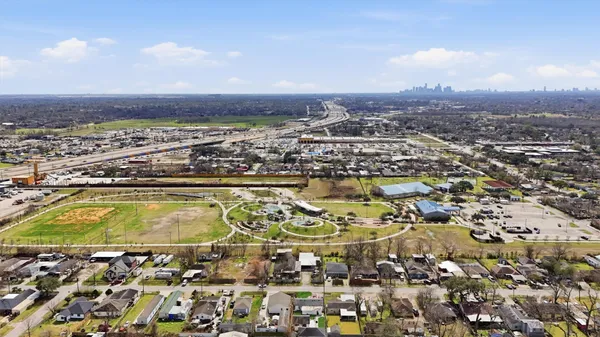 an aerial view of residential houses with outdoor space