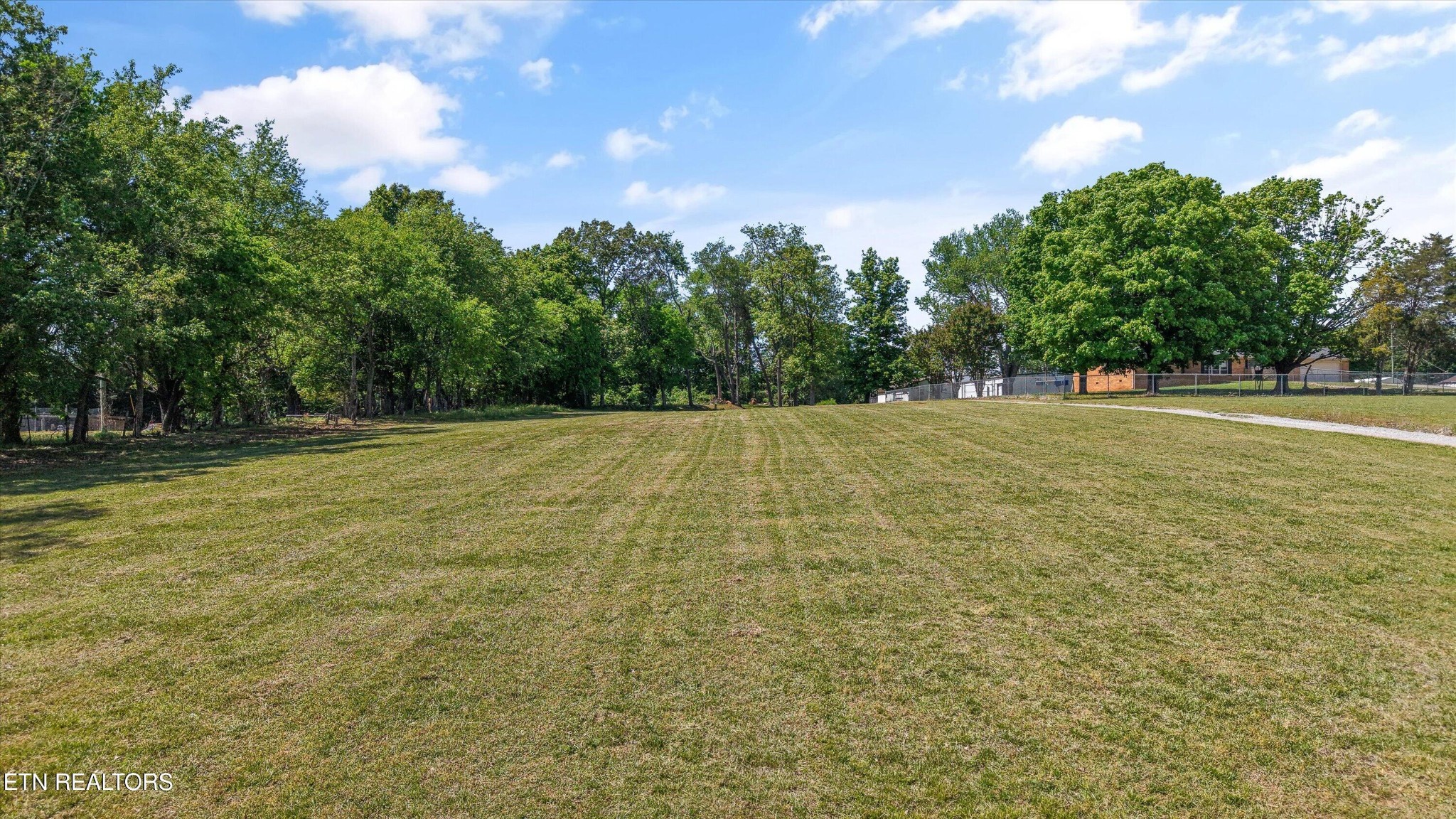 0 Gregory Road Greenback, TN 37742 - Photo 4 of 11 a view of empty field with trees in the background