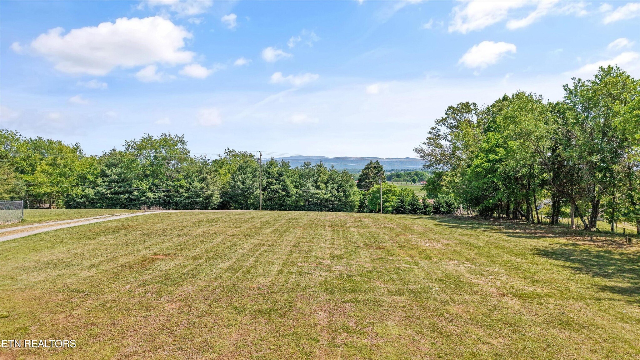 0 Gregory Road Greenback, TN 37742 - Photo 6 of 11 a view of big yard with a house in the background
