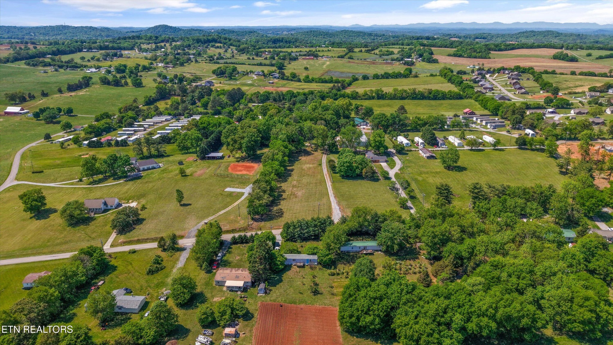 0 Gregory Road Greenback, TN 37742 - Photo 10 of 11 an aerial view of residential houses with outdoor space and trees