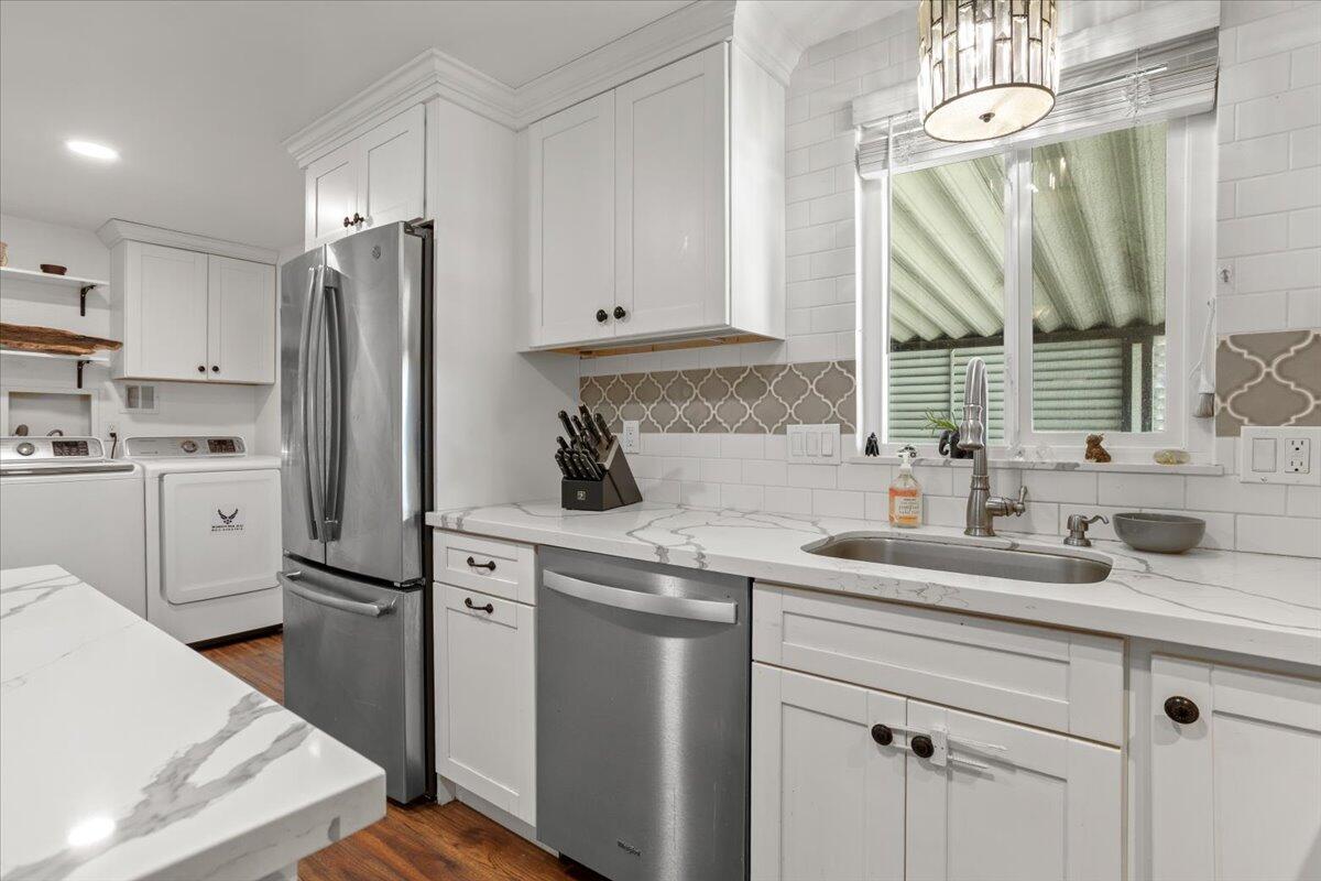 5700 Via Real, Unit 106 Carpinteria, CA 93013 - Photo 13 of 26 a kitchen with appliances cabinets and a sink