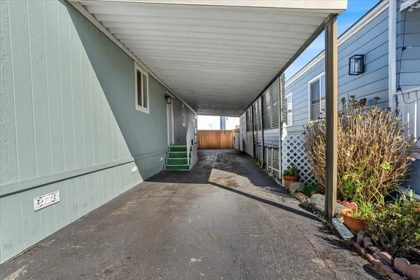 a view of a house with wooden fence