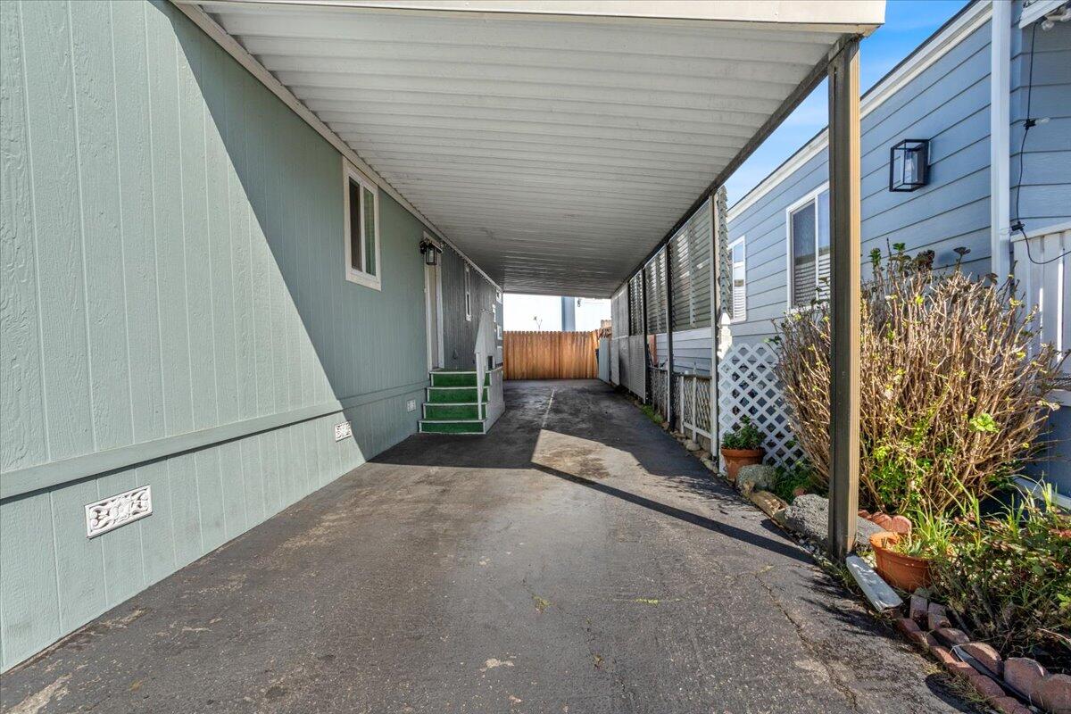 5700 Via Real, Unit 106 Carpinteria, CA 93013 - Photo 3 of 26 a view of a house with wooden fence