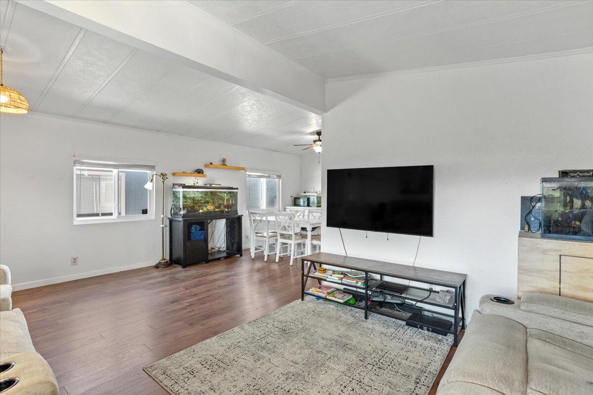 5700 Via Real, Unit 106 Carpinteria, CA 93013 - Photo 8 of 26 a living room with furniture and a flat screen tv