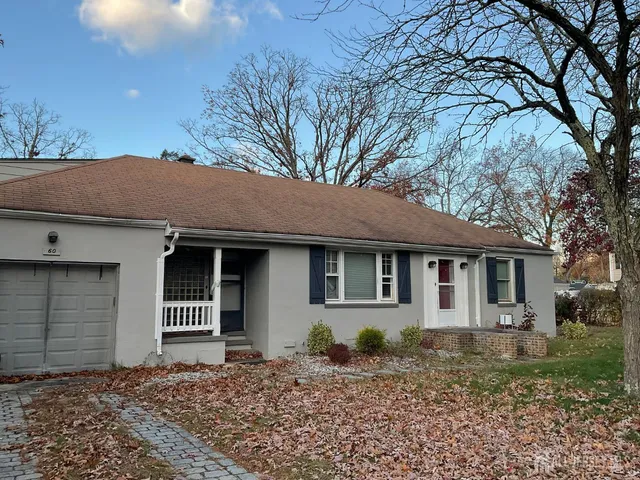 a house with trees in the background