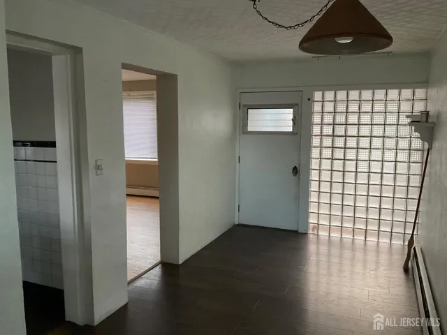 a view of a livingroom with wooden floor