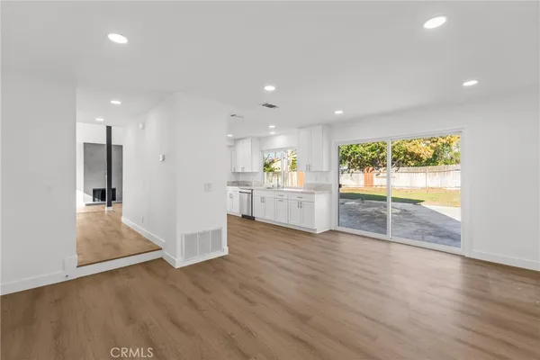 a view of a kitchen with a sink and a window