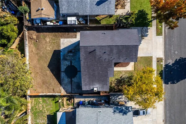a view of a city with a table chairs and wooden floor