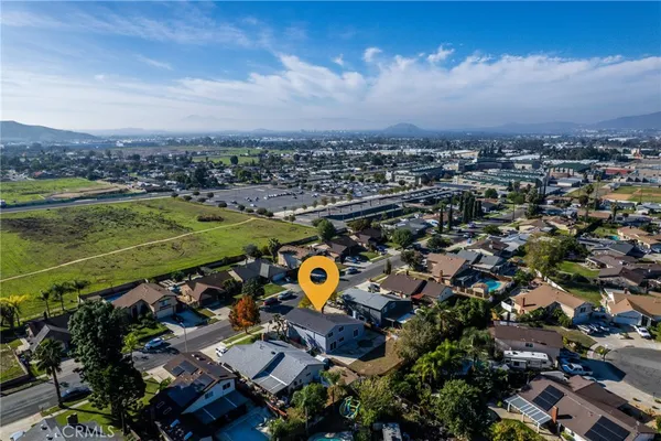an aerial view of residential houses with outdoor space