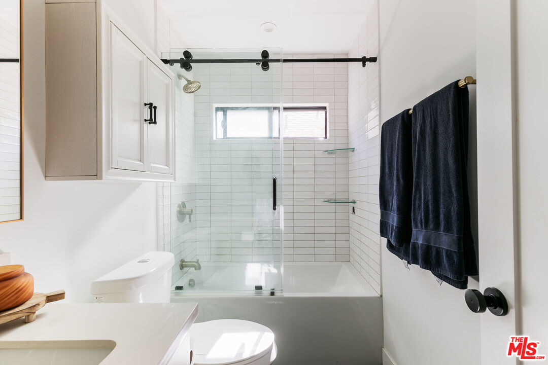331 Brooks Avenue, Unit 2 Venice, CA 90291 - Photo 15 of 30 a bathroom with a sink toilet and shower