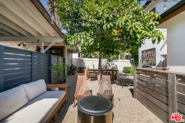 a outdoor living space with furniture and a fireplace
