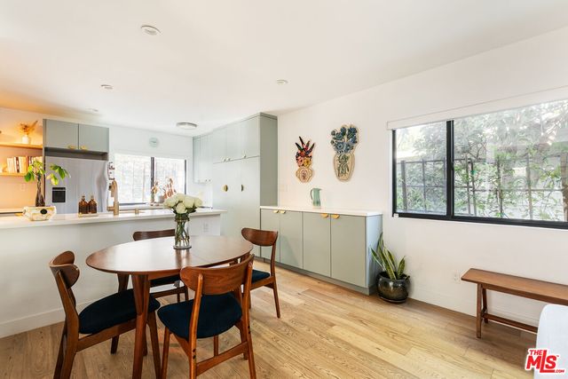 a view of a dining room with furniture window and outside view