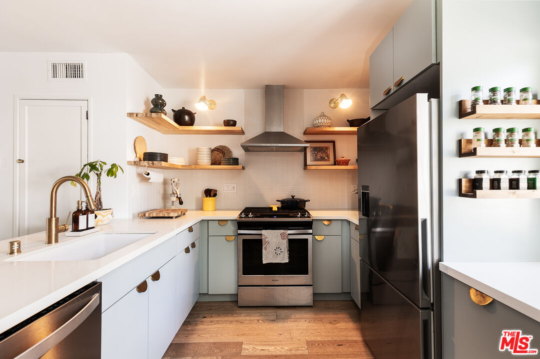 331 Brooks Avenue, Unit 2 Venice, CA 90291 - Photo 6 of 30 a kitchen with stainless steel appliances granite countertop a refrigerator and a sink