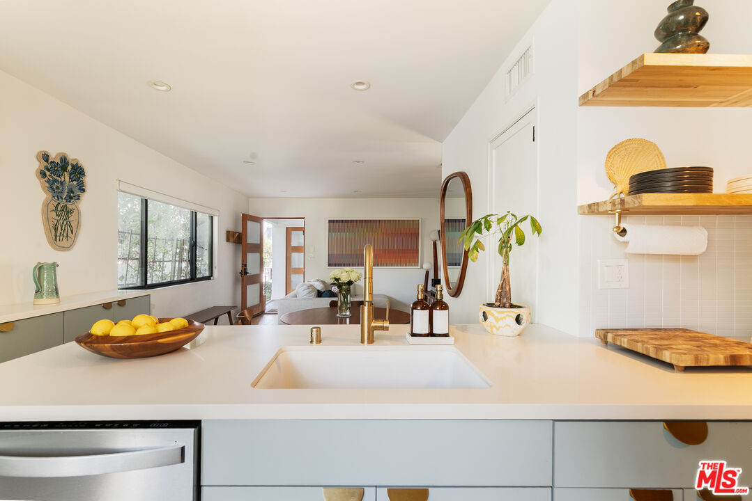 331 Brooks Avenue, Unit 2 Venice, CA 90291 - Photo 9 of 30 a kitchen with a sink and a chandelier