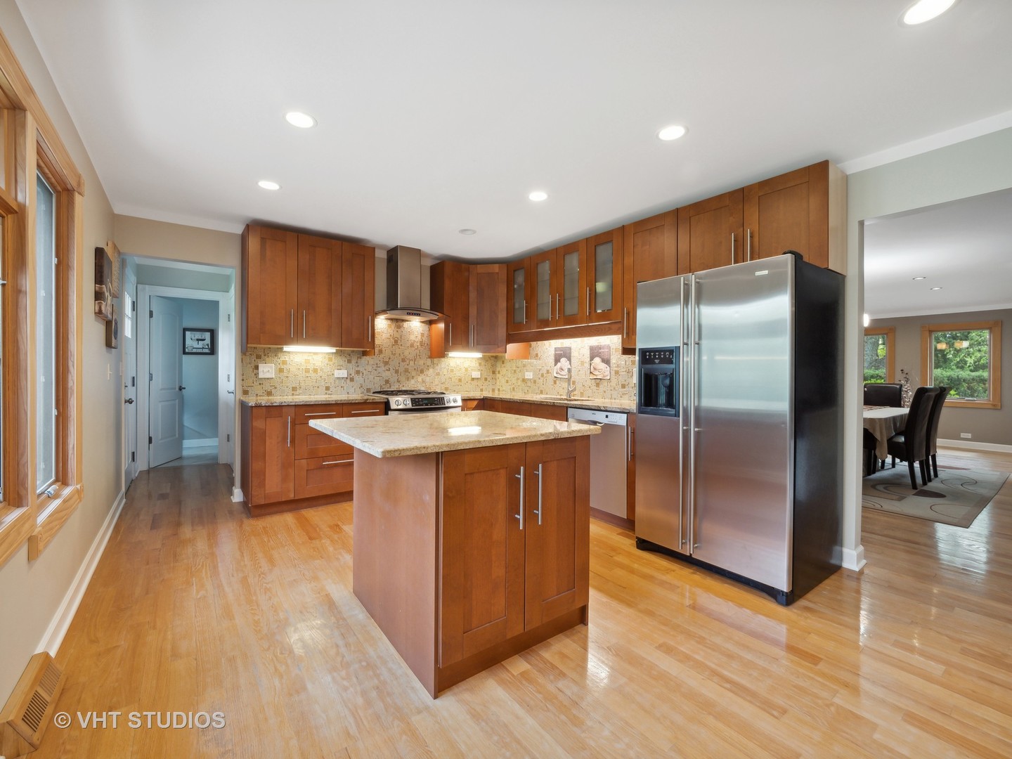 22811 North Quentin Road Kildeer, IL 60047 - Photo 3 of 29 a kitchen with stainless steel appliances granite countertop a refrigerator a stove and a wooden floors
