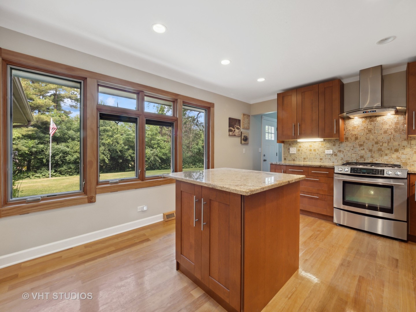 22811 North Quentin Road Kildeer, IL 60047 - Photo 4 of 29 a kitchen with kitchen island granite countertop a stove a sink and a refrigerator