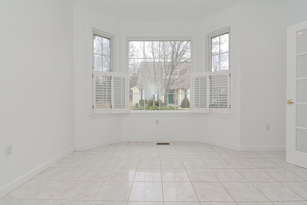 2 Braeburn Lane, Unit 2 Ashland, MA 01721 - Photo 12 of 36 an empty room with windows