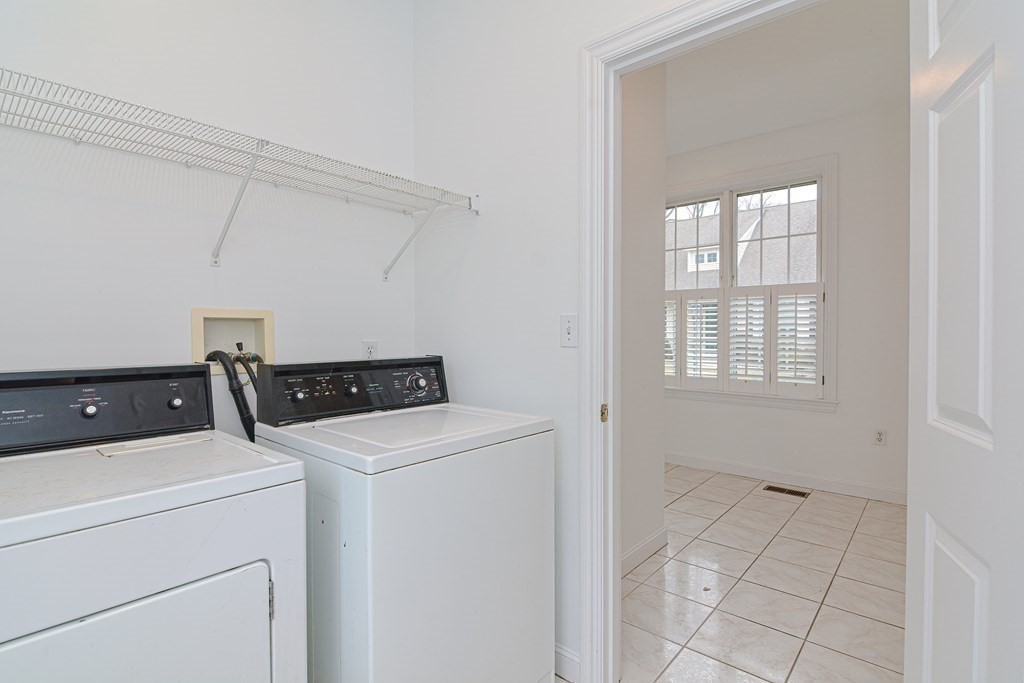 2 Braeburn Lane, Unit 2 Ashland, MA 01721 - Photo 15 of 36 a utility room with dryer and washer