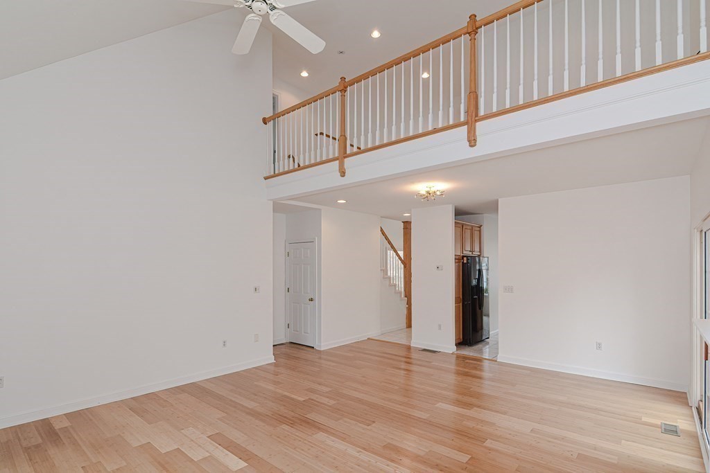 2 Braeburn Lane, Unit 2 Ashland, MA 01721 - Photo 20 of 36 a view of an empty room with wooden floor