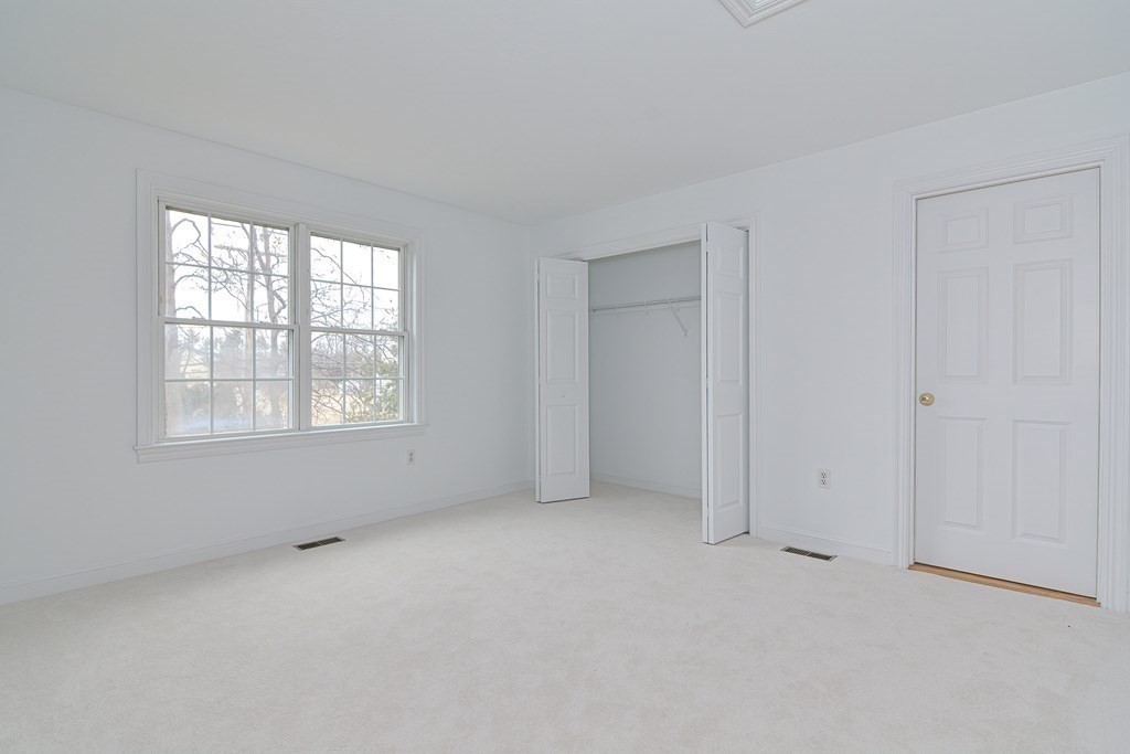 2 Braeburn Lane, Unit 2 Ashland, MA 01721 - Photo 28 of 36 an empty room with windows
