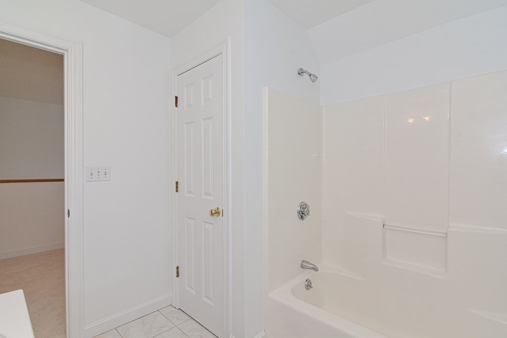 2 Braeburn Lane, Unit 2 Ashland, MA 01721 - Photo 31 of 36 a bathroom with a bathtub