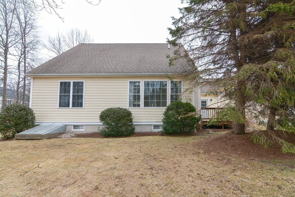 2 Braeburn Lane, Unit 2 Ashland, MA 01721 - Photo 33 of 36 a front view of a house with garden