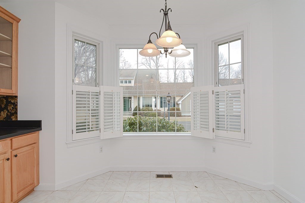 2 Braeburn Lane, Unit 2 Ashland, MA 01721 - Photo 8 of 36 a view of an empty room with a window