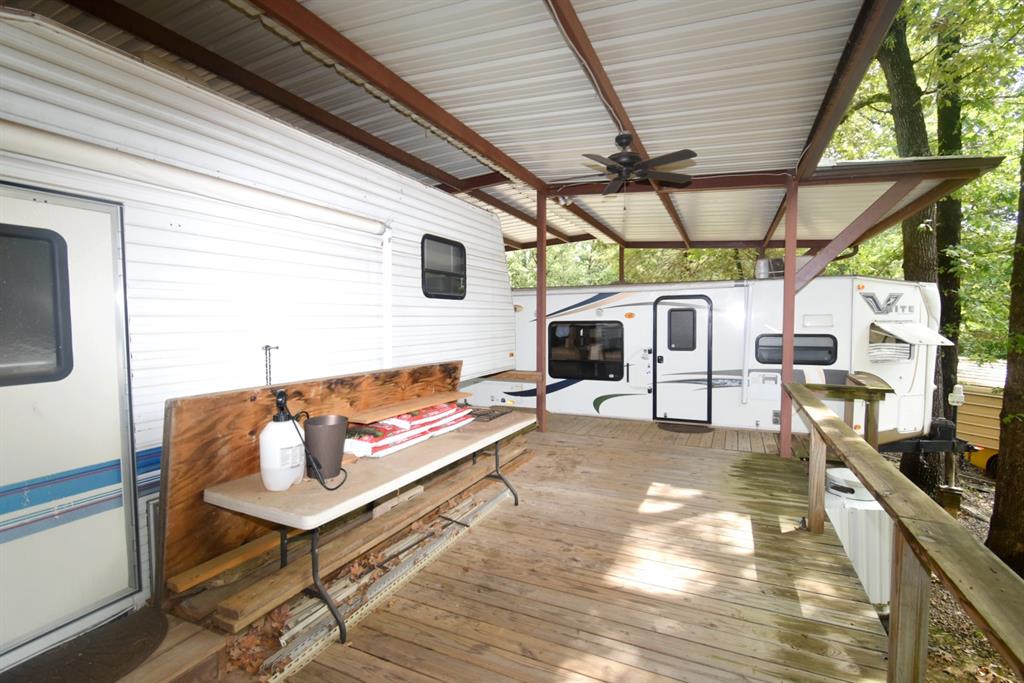 6435 FM 17, Unit 477 Yantis, TX 75497 - Photo 3 of 35 a outdoor space with the couches and dining table with the potted plant