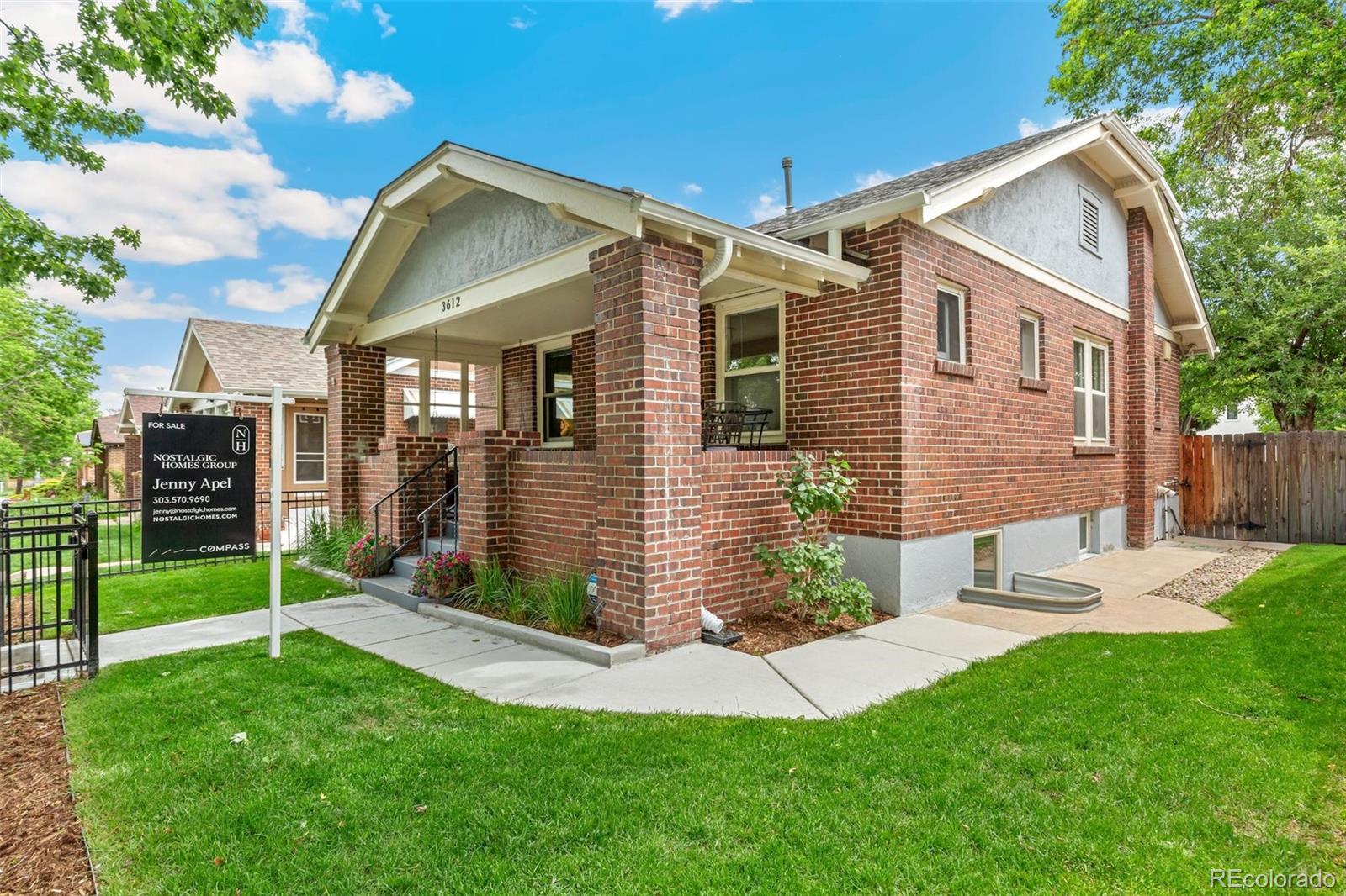 3612 Perry Street Denver, CO 80212 - Photo 2 of 50 a view of a house with a yard and a garden