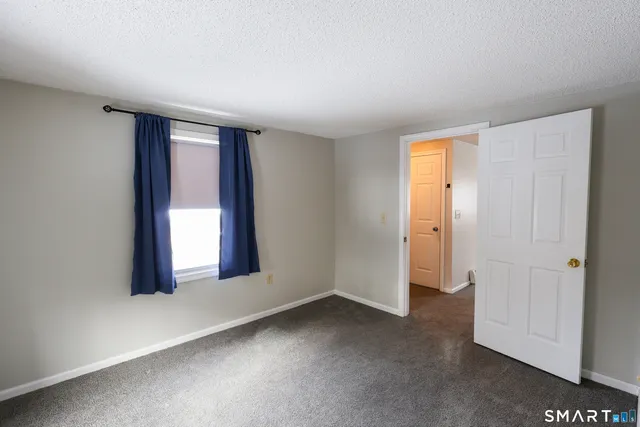 an empty room with closet area