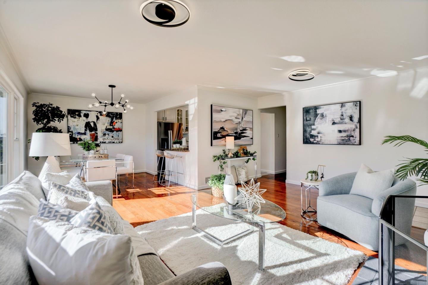 391 Imperial Drive Pacifica, CA 94044 - Photo 11 of 60 a living room with furniture and a flat screen tv