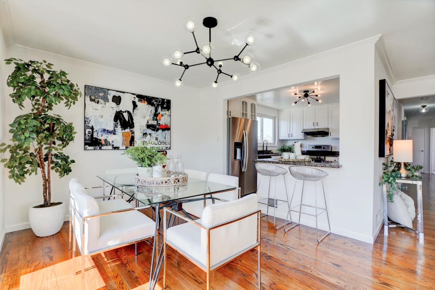 391 Imperial Drive Pacifica, CA 94044 - Photo 12 of 60 a living room with furniture and a chandelier