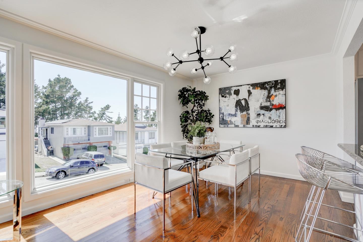 391 Imperial Drive Pacifica, CA 94044 - Photo 13 of 60 a view of a dining room with furniture window and wooden floor