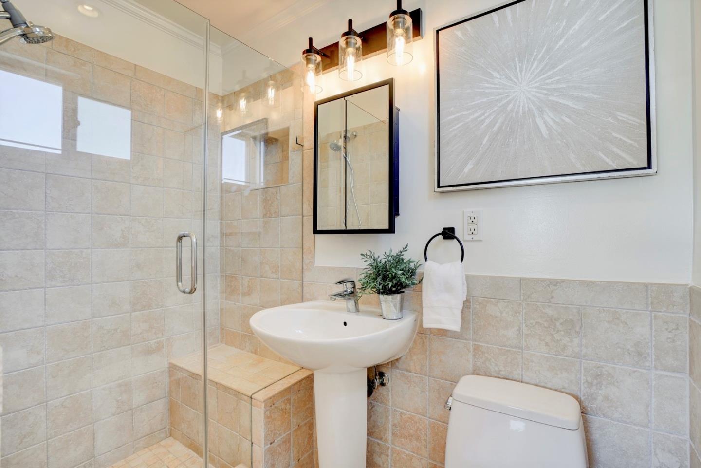 391 Imperial Drive Pacifica, CA 94044 - Photo 25 of 60 a bathroom with a sink mirror and toilet