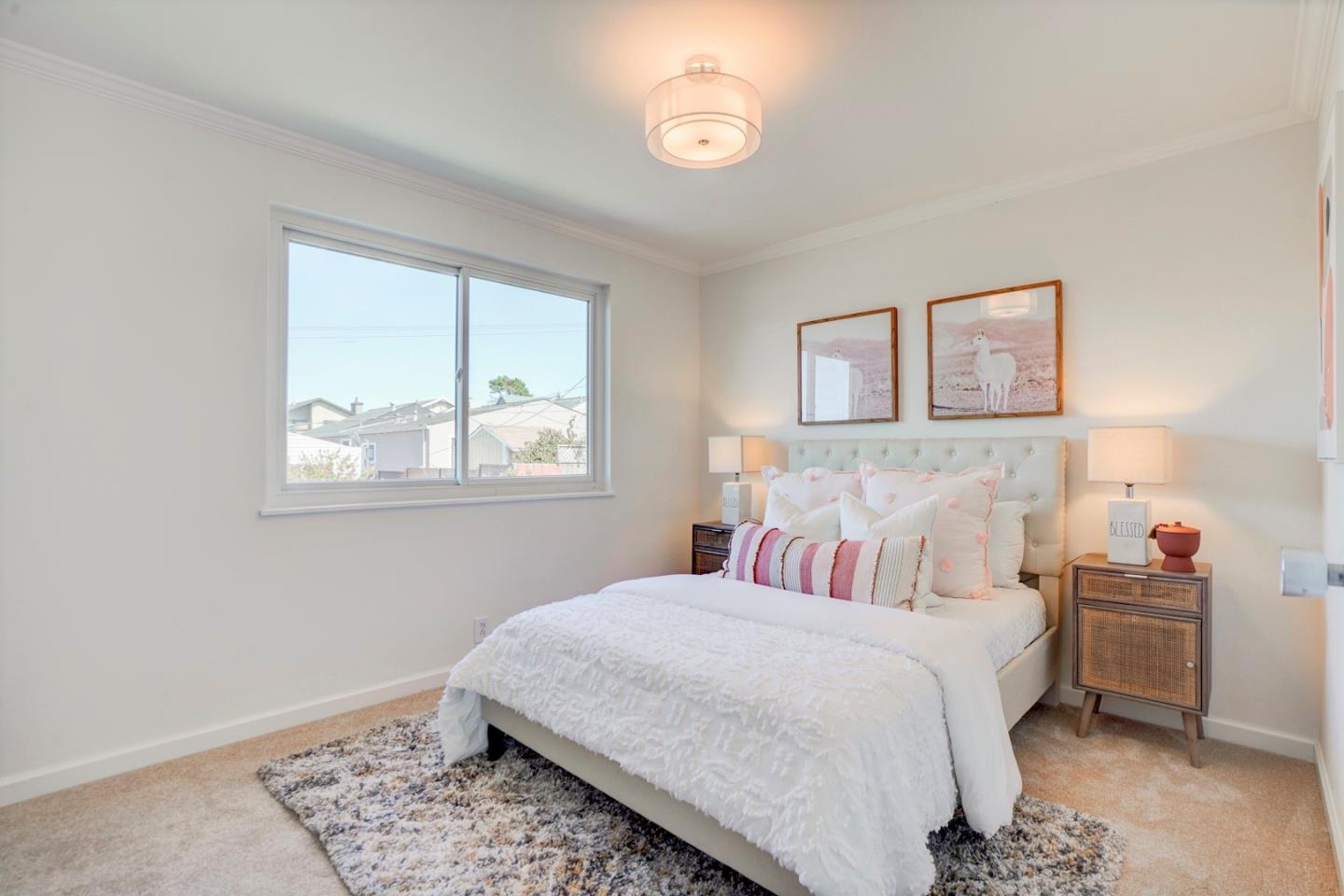 391 Imperial Drive Pacifica, CA 94044 - Photo 26 of 60 a bedroom with a bed and a window