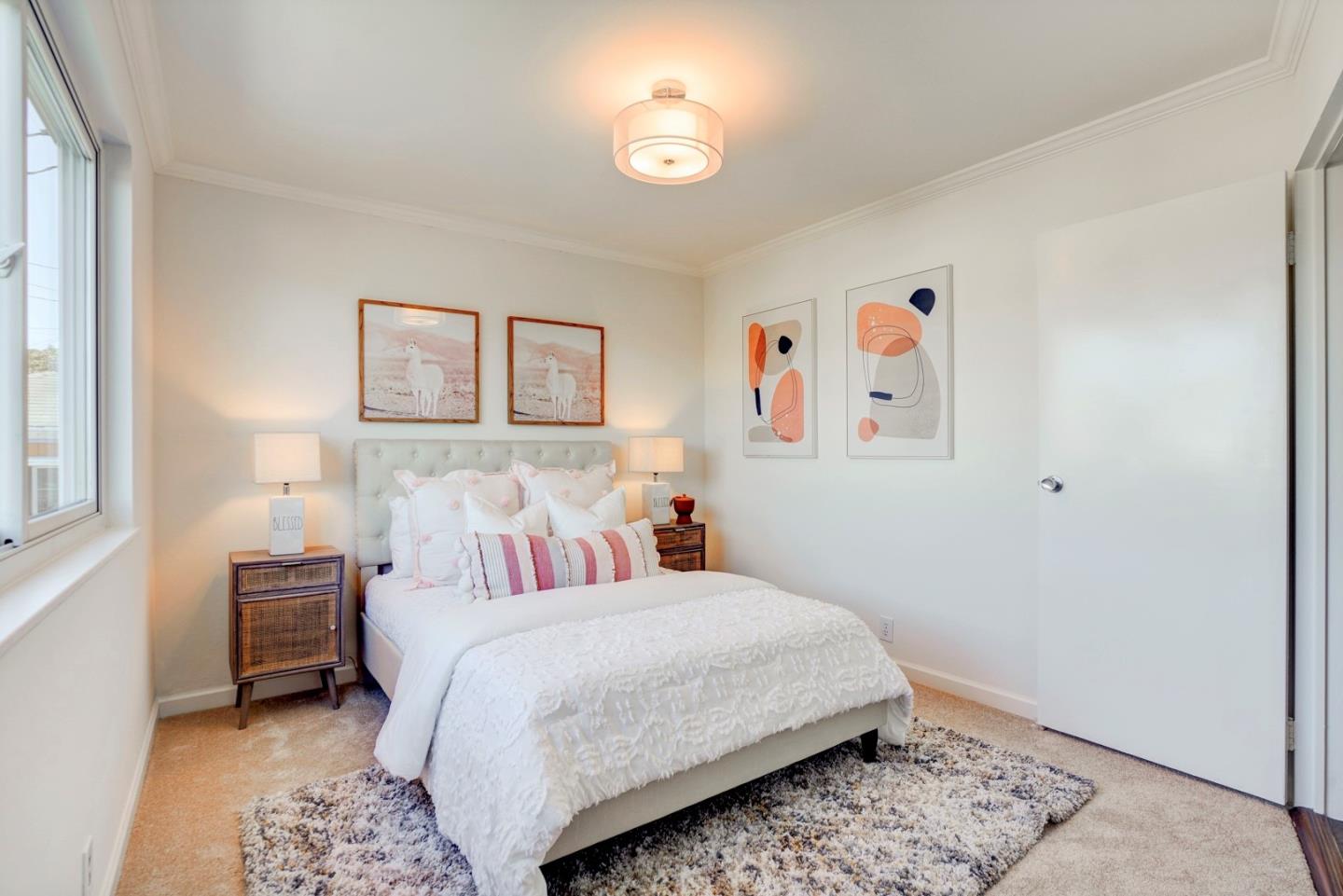 391 Imperial Drive Pacifica, CA 94044 - Photo 27 of 60 a bedroom with a bed and a window