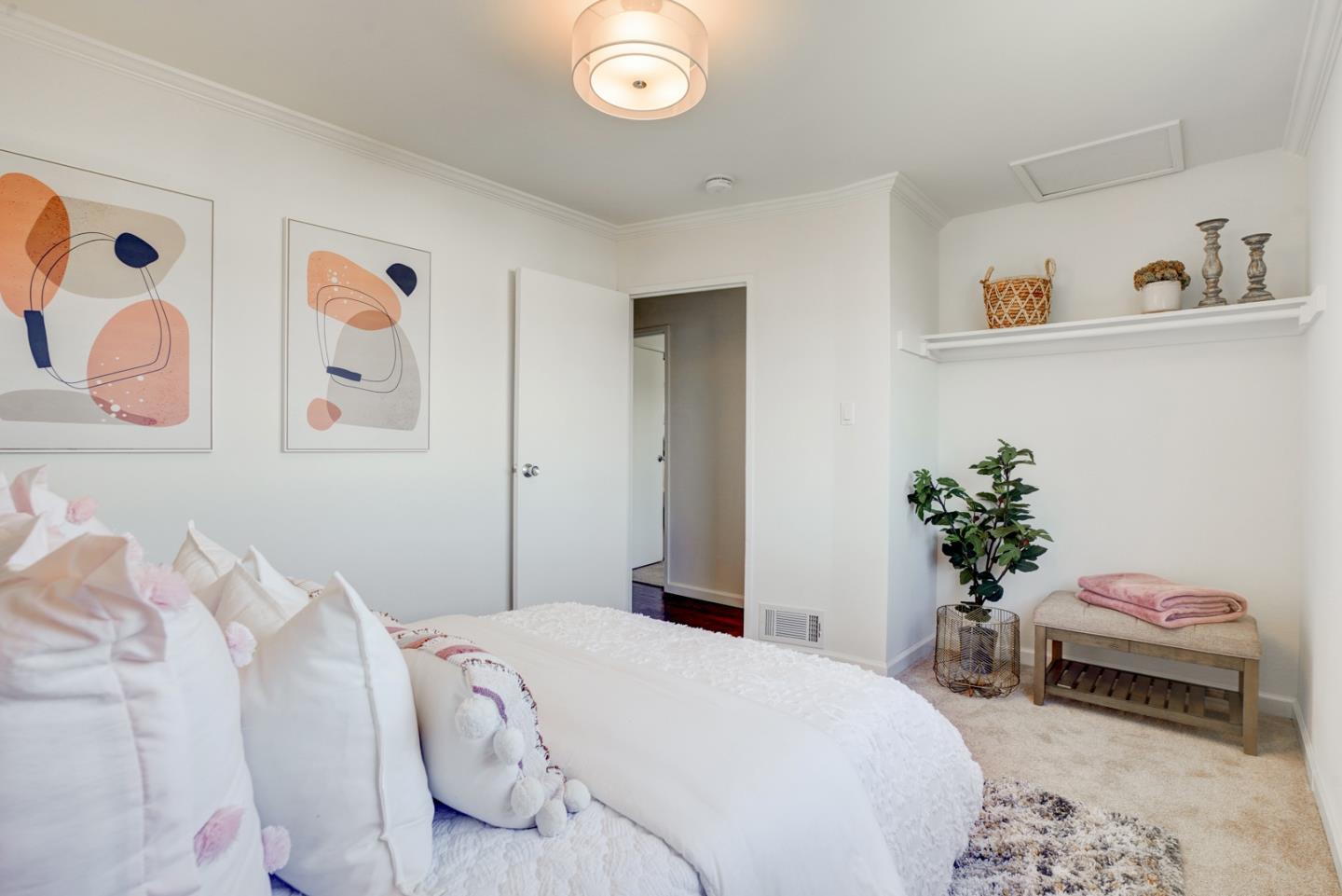 391 Imperial Drive Pacifica, CA 94044 - Photo 28 of 60 a bedroom with a bed and a couch