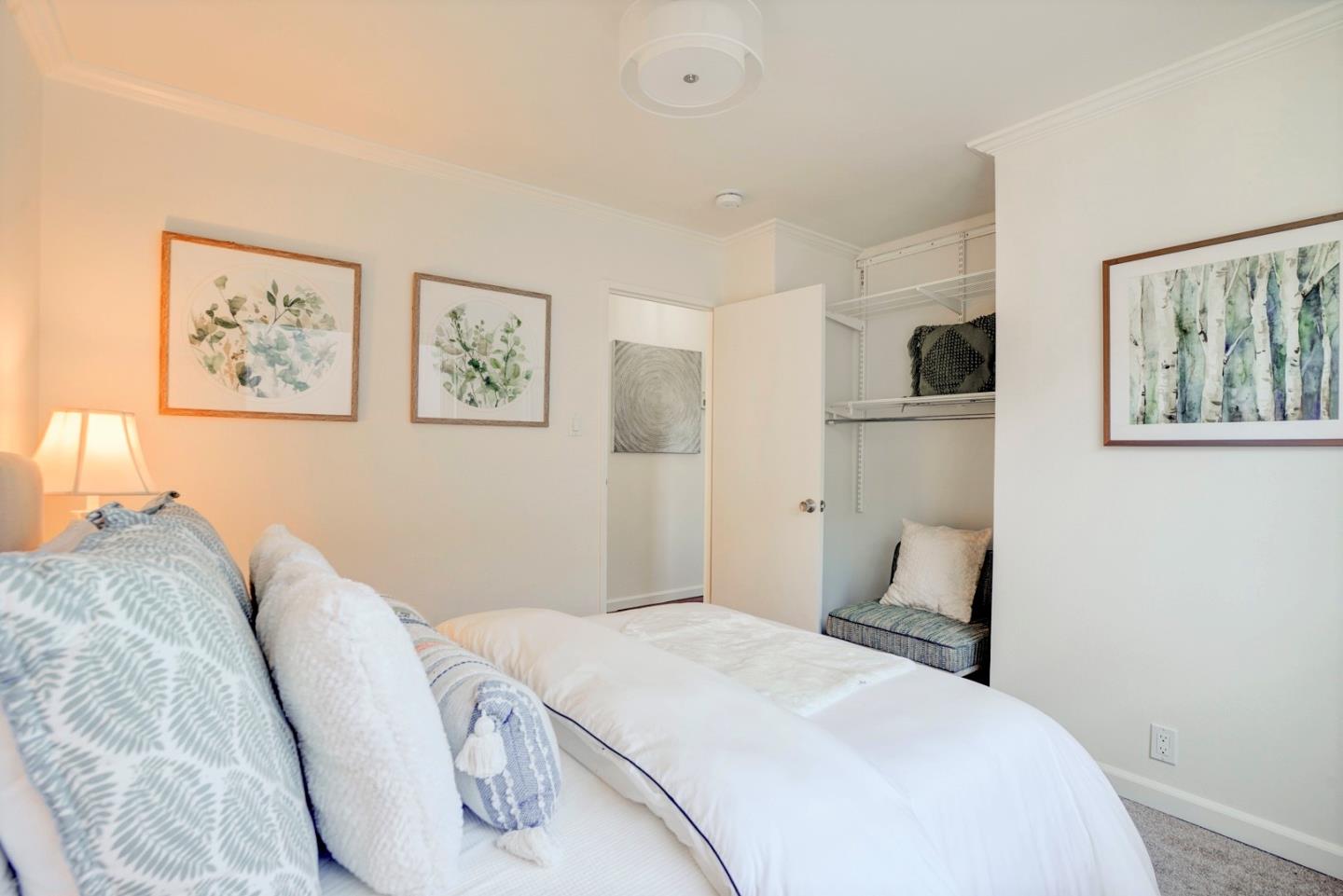 391 Imperial Drive Pacifica, CA 94044 - Photo 34 of 60 a bedroom with a bed and a painting on the wall