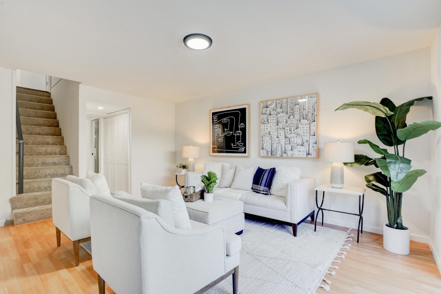 391 Imperial Drive Pacifica, CA 94044 - Photo 39 of 60 a living room with furniture potted plant and a window