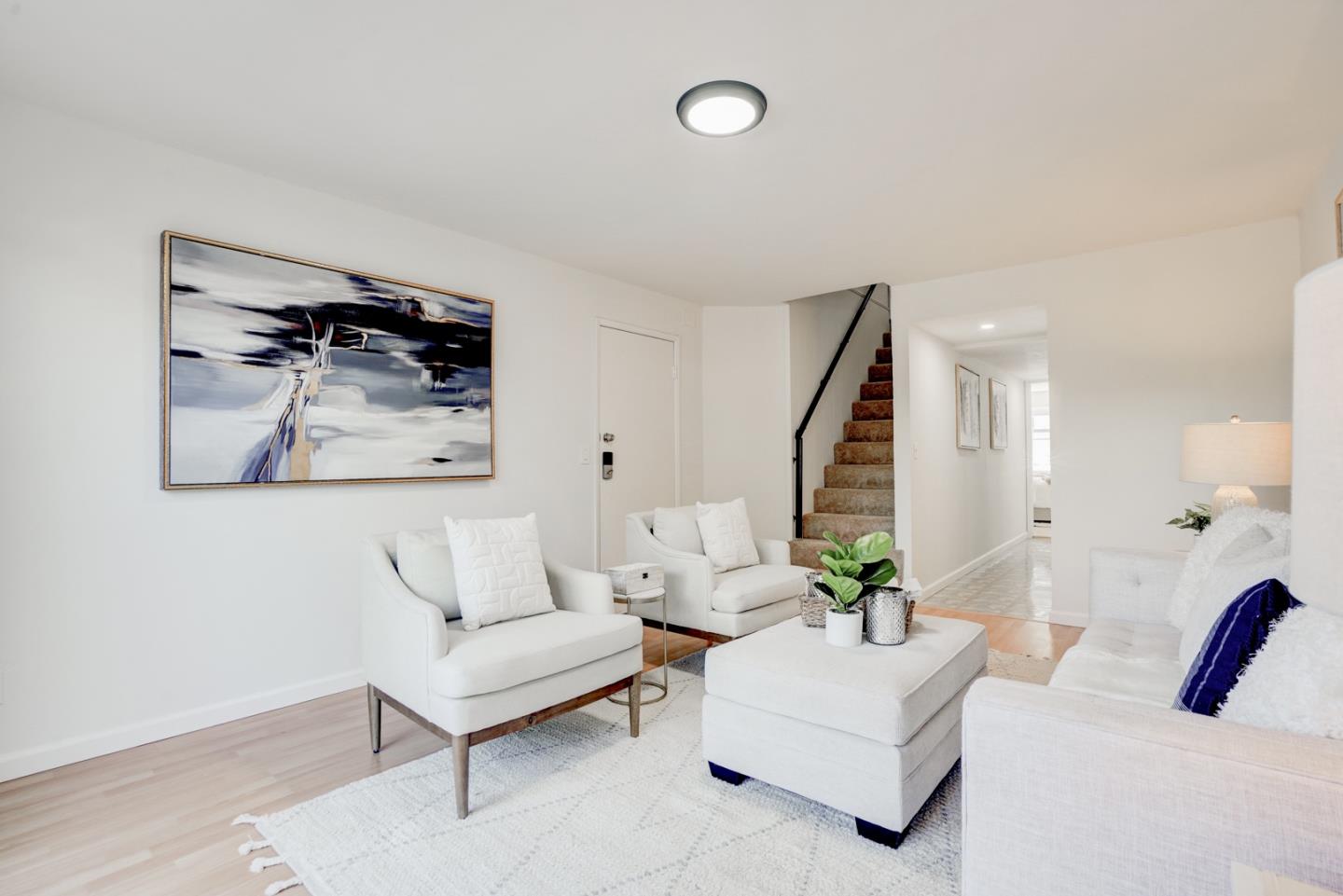 391 Imperial Drive Pacifica, CA 94044 - Photo 41 of 60 a living room with furniture and a potted plant