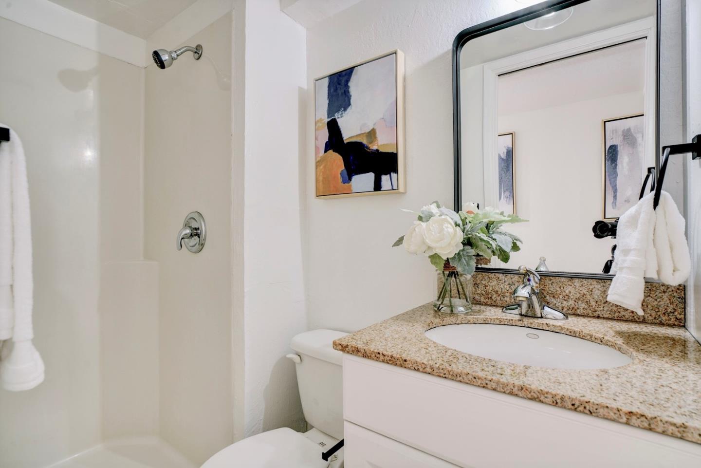391 Imperial Drive Pacifica, CA 94044 - Photo 44 of 60 a bathroom with a granite countertop sink and a mirror