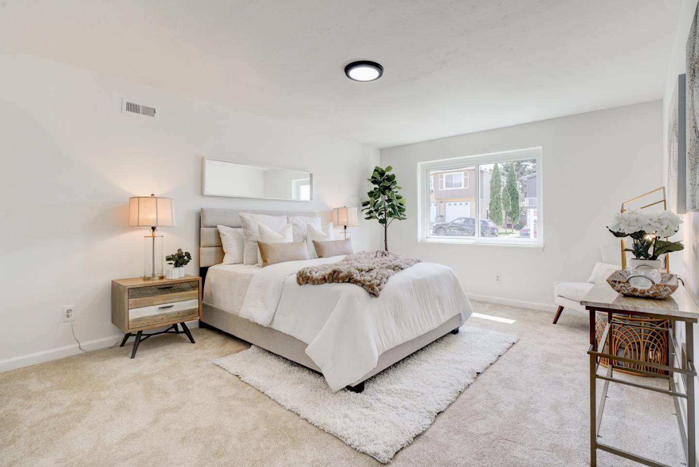 391 Imperial Drive Pacifica, CA 94044 - Photo 45 of 60 a bed room with a bed and a table