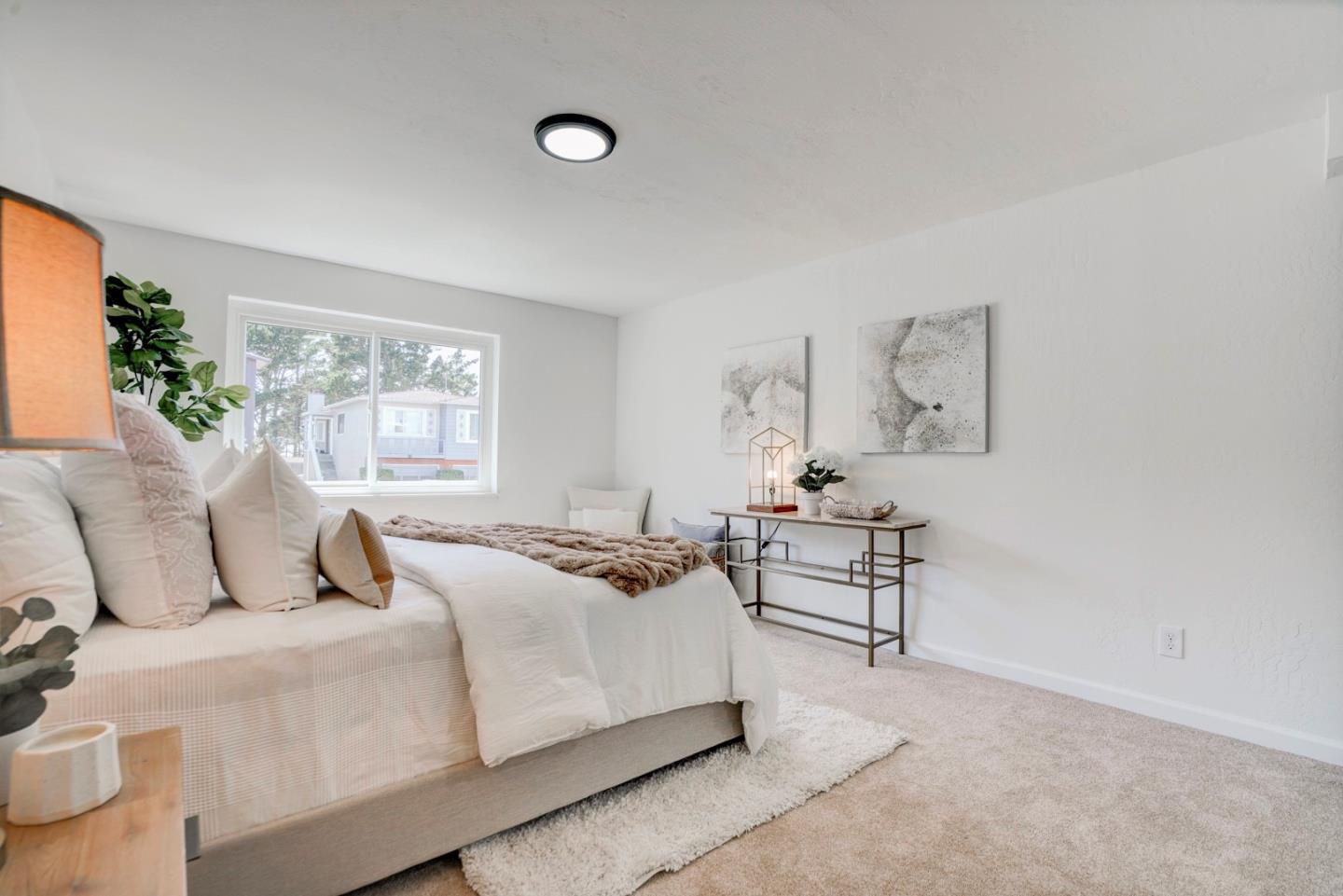 391 Imperial Drive Pacifica, CA 94044 - Photo 46 of 60 a bedroom with a bed and a window