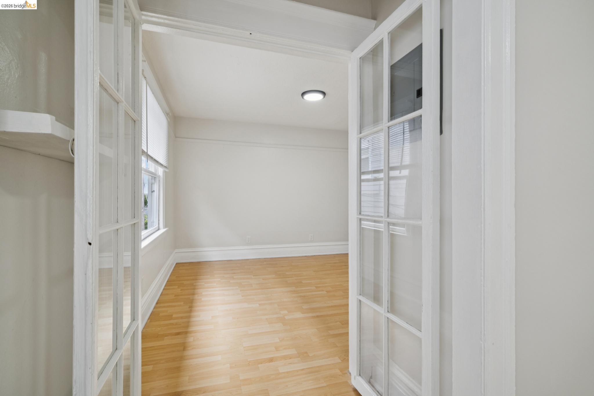 2923 Wheeler Street, Unit C Berkeley, CA 94705 - Photo 12 of 19 a view of a hallway with wooden floor and staircase