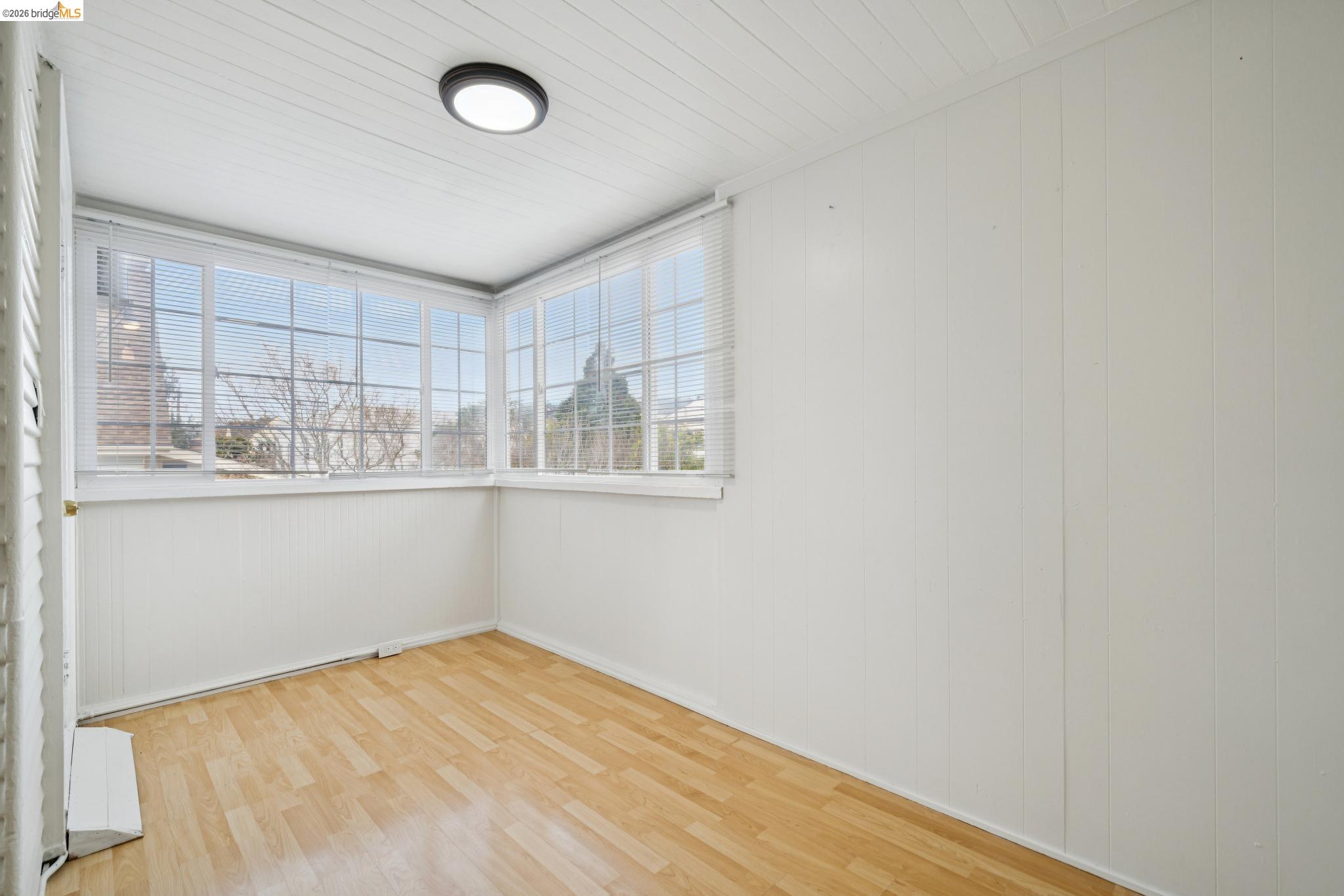 2923 Wheeler Street, Unit C Berkeley, CA 94705 - Photo 10 of 19 a view of empty room with wooden floor and fan