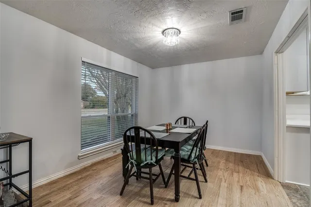a large bathroom with a large mirror and sink