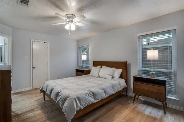 a room with wooden floor and gym equipment