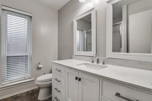 a bathroom with a shower and a toilet